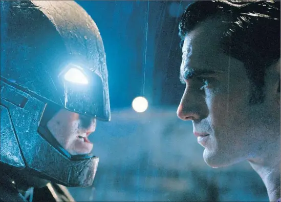  ?? Warner Bros. ?? THE FACE- OFF BETWEEN Ben Aff leck, left, as Batman and Henry Cavill as Superman comes as both question their missions in Zack Snyder’s gritty new f ilm.