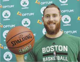  ?? STAFF PHOTO BY CHRISTOPHE­R EVANS ?? BIG PICKUP: Center Aron Baynes, who was signed by the Celtics last week, poses yesterday at the team’s practice facility in Waltham.