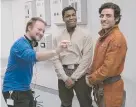  ??  ?? Director Rian Johnson with actors John Boyega and Oscar Isaac during filming for The Last Jedi.