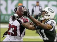  ?? SETH WENIG — THE ASSOCIATED PRESS FILE ?? In this Oct. 29 photo, New York Jets wide receiver Robby Anderson (11) catches a pass in front of Atlanta Falcons’ Robert Alford (23) during the second half of an NFL football game in East Rutherford, N.J.