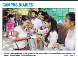  ??  ?? Freshers being welcomed by the seniors for the new academic session after the summer break at Ramjas College in New Delhi on Wednesday. SUSHIL KUMAR/ HT