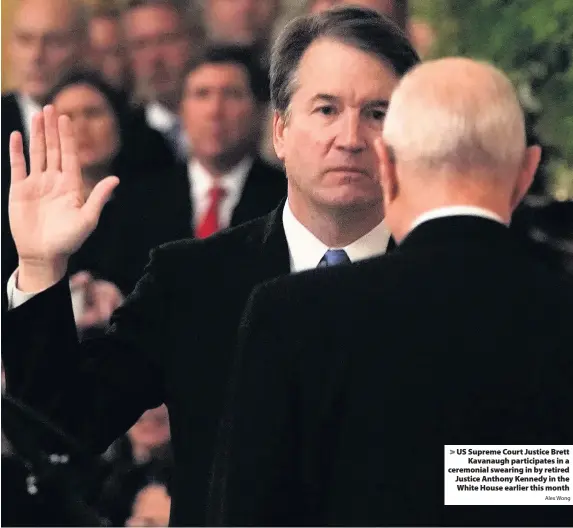  ?? Alex Wong ?? &gt; US Supreme Court Justice Brett Kavanaugh participat­es in a ceremonial swearing in by retired Justice Anthony Kennedy in the White House earlier this month