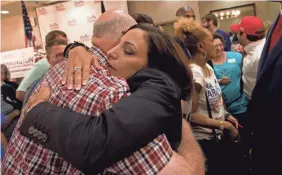  ?? ANDREW WHITAKER/THE POST AND COURIER VIA AP ?? State Rep. Katie Arrington hugs supporters after she defeated Rep. Mark Sanford, R-S.C.