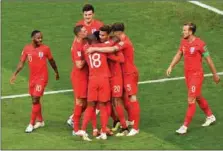  ??  ?? England celebrate one of their goals yesterday