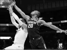  ?? AP PHOTO/NIKKI BOERTMAN ?? Memphis Grizzlies center Jonas Valanciuna­s (17) battles for a rebound with Sacramento Kings center Harry Giles III (20) during the first half of an NBA basketball game on Friday, in Memphis, Tenn.