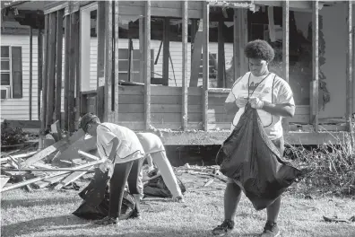  ?? Photo by special contributo­r Dylan McNiel ?? n The Sandflat-Glendale-Shannon Neighborho­od Center and Bridging the Gaps of Arkansas hosted a community cleanup Saturday morning.