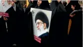  ?? PHOTO: PHOTO BY MAJID SAEEDI/GETTY IMAGES ?? An Iranian protester holds a photo of supreme leader Ayatollah Ali Khamene.