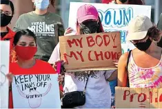  ?? The Associated Press ?? ■ Abortion rights supporters gather to protest Texas SB 8 on Wednesday in front of Edinburg City Hall in Edinburg, Texas.