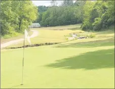  ?? RICK PECK/SPECIAL TO MCDONALD COUNTY PRESS ?? Looking back down the fairway on the 12th hole at Big Sugar Golf Club in Pea Ridge. The signature hole requires a second shot of 200 yards while avoiding woods on both sides and water down the middle.