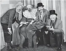  ?? WGN-TV ?? “Bozo’s Circus” in 1963 stars Ray Rayner as Oliver, from left, Bob Bell as Bozo the Clown, Don Sandburg as Sandy the clown, and Ned Locke as Ringmaster Ned.