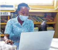  ??  ?? Shushana Samuels, home economics teacher at Muschett High School, engages students on the Google Classroom online platform yesterday.