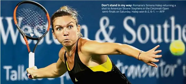  ??  ?? Don’t stand in my way: Romania’s Simona Halep returning a shot to American Sloane Stephens in the Cincinnati Open semi-finals on Saturday. Halep won 6-2, 6-1. — AFP