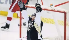  ?? AP ?? The Penguins’ Blake Comeau celebrates after scoring against the Red Wings.