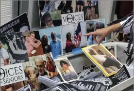  ?? YUKI IWAMURA - ASSOCIATED PRESS ?? In this Oct. 18, 2020, file photo, families of COVID-19 victims who died in New York nursing homes gather in front of Cobble Hill Heath Center in Brooklyn, where photos of the victims were posted.