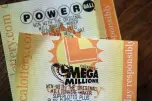  ??  ?? Powerball and Mega Millions lottery tickets are displayed in San Anselmo, California. — AFP