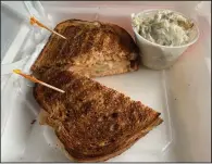  ?? (Arkansas Democrat-Gazette/Eric E. Harrison) ?? Corned beef is too expensive at the moment, so the Capitol Bistro, on Capitol Avenue a block from the state Capitol, is making reubens with turkey instead. A pleasant potato salad is a side option.