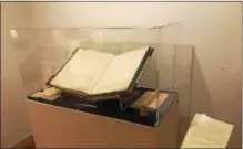  ??  ?? The book in the glass case is Chester County’s first deed currently on display at the Chester County Historical Society.