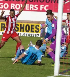  ??  ?? Ryan De Vries celebrates as David Cawley’s effort hits the back of the net. Pic: Donal Hackett.