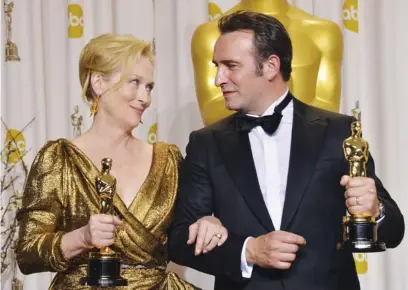  ?? AGENCE FRANCE PRESSE ?? Best Actress Meryl Streep and Best Actor Jean Dujardin celebrate their Oscars in the press room at the 84th Annual Academy Awards in Hollywood, California. More photos and list of winners on page 17.