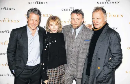  ?? REUTERS/HENRY NICHOLLS ?? Singer Sting and his wife, Trudie Styler, actor Hugh Grant and director Guy Ritchie pose as they arrive for a special screening of “The Gentlemen” in London, England, on Dec. 3, 2019.