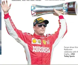  ?? —USA Today Sports ?? Ferrari driver Kimi Raikkonen celebrates with the trophy.