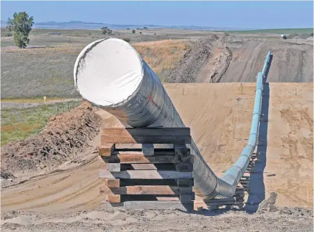  ?? Tom Stromme / Bismarck Tribune file ?? The Dakota Access Pipeline, now complete, is moving oil from North Dakota’s Bakken Shale to Patoka, Ill., and then to the Gulf Coast.