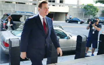  ?? (Jonathan Ernst/Reuters) ?? FORMER TRUMP CAMPAIGN manager Paul Manafort arrives for arraignmen­t on a third supersedin­g indictment against him by Special Counsel Robert Mueller on charges of witness tampering, at US District Court in Washington on Friday.