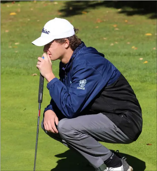  ?? JULIA MALAKIE — LOWELL SUN ?? Dracut High’s Colin Underwood studies a putt on the ninth green during the Merrimack Valley Conference golf tournament in 2000at Mt. Pleasant Golf Club in Lowell. Despite taking up the game late, he’s one of the region’s top players.