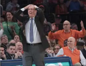  ?? MARY ALTAFFER - THE ASSOCIATED PRESS ?? Syracuse head coach Jim Boeheim, foreground, reacts during the second half of an NCAA college basketball consolatio­n game against Oregon in the 2K Empire Classic, Friday, Nov. 16, 2018, at Madison Square Garden in New York.