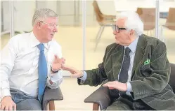  ?? Picture: PA. ?? Sir Alex Ferguson, left, speaking to Harry Benson.