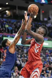  ?? Kyle Phillips / Associated Press ?? Clint Capela, right, returned for the Rockets on Monday after missing three of the past four games with an injury. He had 19 points and 10 rebounds.