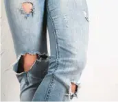  ?? DREAMSTIME ?? Wear your ripped, distressed jeans now, but don’t buy any more, says Answer Angel Ellen Warren.