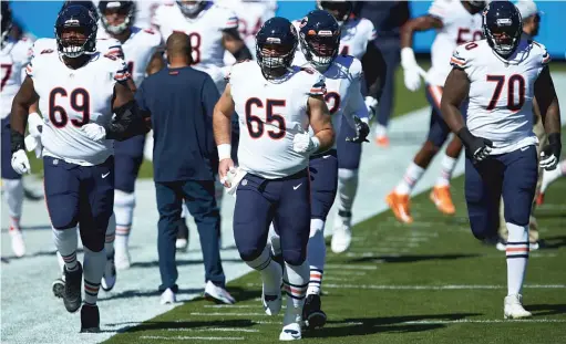  ?? AP ?? Center Cody Whitehair (65) was put on the COVID-19 reserve list, but the Bears were able to practice Friday. Three backups will start on the offensive line Sunday.
