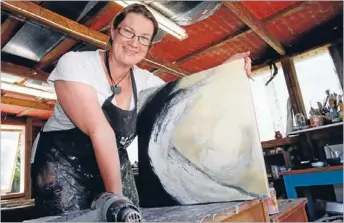  ?? Photo: CHARLOTTE
SQUIRE/ FAIRFAX NZ ?? Exhibitor: Encaustic artist Jo Campbell at work in the studio. Her paintings are on show at the Kereru Gallery, Mariri.