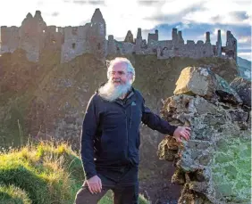  ?? (AFP) ?? Former British actor Flip Robinson, now owner and operator tour guide for Giant Tours Ireland, at the Dunluce Castle, in Bushmills, on the north Antrim coast, one of the many locations used for internatio­nal film and TV shows