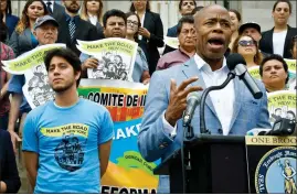  ?? AP PHOTO BY BEBETO MATTHEWS ?? Martin Batalla Vidal, front left, listen as Brooklyn Borough President Eric Adams, front right, address a coalition rally of legal and civil rights groups going to court to challenge President Trump’s planned phase out of a program shielding young...