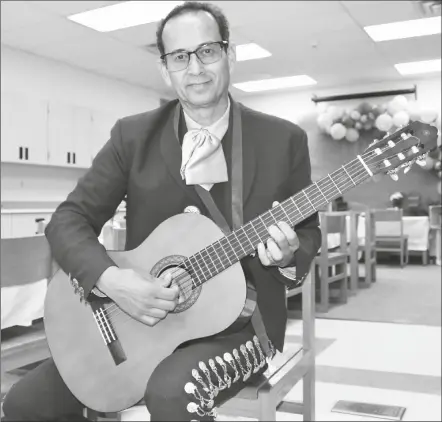  ?? PHOTO BY CESAR NEYOY/BAJO EL SOL ?? DAVID CASTRO, A LONGTIME MUSIC TEACHER in the Gadsden Elementary School District, is retiring after a 25-year career, during which he helped start the district’s mariachi and norteno music groups.