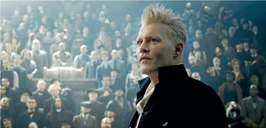  ??  ?? Johnny Depp seems to be channellin­g 1980s-era David Bowie in his role as Grindelwal­d.