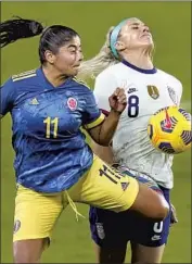  ?? John Raoux Associated Press ?? COLOMBIA’S Catalina Usme (11) and the United States’ Julie Ertz collide as they vie for the ball.