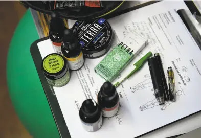  ?? Photos by Michael Short / Special to The Chronicle ?? Above: Medical cannabis tinctures, topical creams, edibles and vaporizer pens in nurse practition­er Eloise Theisen’s office. Below: Theisen explains a tincture to patient Carl P.