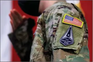  ?? (File Photo/AP/Noah Berger) ?? An Air Force specialist salutes Feb. 12, 2021, in a U.S. Space Force uniform during a ceremony for U.S. Air Force airmen transition­ing to U.S. Space Force Guardian designatio­ns at Travis Air Force Base, Calif.