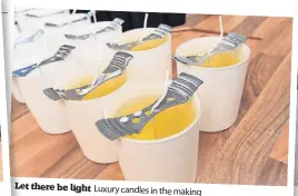  ?? ?? Let there be light Luxury candles in the making