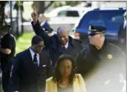  ?? COREY PERRINE — THE ASSOCIATED PRESS ?? Bill Cosby, center, reacts after spokespers­on Andrew Wyatt, left, addressed the media for Cosby’s sexual assault trial at the Montgomery County Courthouse, Thursday in Norristown.