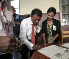  ??  ?? Ravalomana­na arrives to cast his ballot in the first round of the presidenti­al election in Faravohitr­a district, in Antananari­vo. — AFP photo