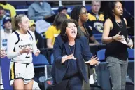  ?? Hans Pennink / Associated Press ?? Quinnipiac women’s basketball coach Tricia Fabbri recently collected her 450th career win.