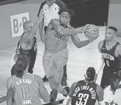  ?? AP ?? The Thunder's Luguentz Dort (5), a former Arizona State star, drives against the Rockets during a playoff game on Saturday in Lake Buena Vista, Fla.