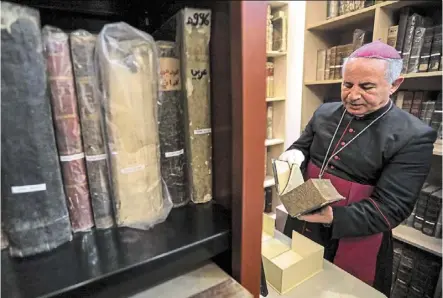  ?? — Photos: AFP ?? For centuries, Syriac was spoken among Christians in Iraq and neighbouri­ng Syria, mostly at home or some schools, and today it remains the backbone of liturgy.