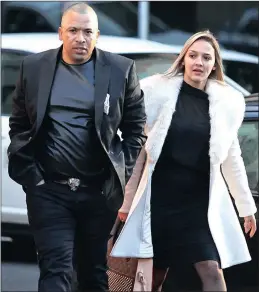  ?? PICTURE: WILLEM LAW ?? Alleged 28s gang kingpin, Ralph Stanfield and his wife, Nicole Stanfield, approach the Cape Town Magistrate’s Court.