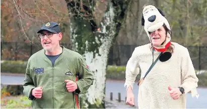  ??  ?? Neck and neck Race debutant Colin Banks in his air force outfit, left, and Muttley Martin Duthie, right