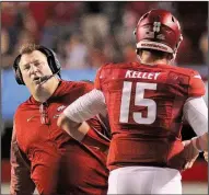  ?? Arkansas Democrat-Gazette/BENJAMIN KRAIN ?? Arkansas Coach Bret Bielema (left) officially confirmed Monday that freshman quarterbac­k Cole Kelley (right) has been suspended indefinite­ly following his arrest Sunday on suspicion of driving while intoxicate­d and two other charges.